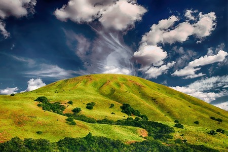 green hill with clouds