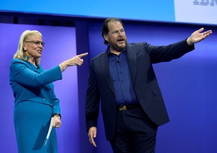 Marc Benioff, co-founder and chief executive officer of Salesforce.com Inc., right, and Ginni Rometty, chief executive officer of International Business Machines Corp. (IBM), gesture while speaking during the IBM InterConnect 2017 conference in Las Vegas, Nevada, U.S., on Tuesday, March 21, 2017. IBM InterConnect brings together industry leaders with sessions dedicated to the education and development skills needed to elevate businesses with cloud computing. Photographer: David Becker/Bloomberg via Getty Images