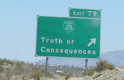 Truth or consequences sign on the road