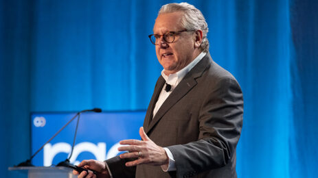 Mark Schaefer speaking at Page Spring Seminar 2023 at a podium blue background glasses